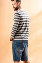 Handsome bearded man posing in striped sweatshirt Royalty Free Stock Photo