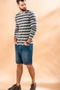 Handsome bearded man posing in striped sweatshirt Royalty Free Stock Photo