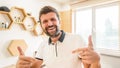 Handsome bearded man smiling gesturing with his hands Royalty Free Stock Photo