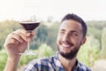 Handsome bearded man sniffs glass of wine Royalty Free Stock Photo