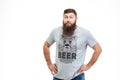 Handsome bearded man standing and staring in camera with rebuke Royalty Free Stock Photo