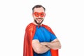 handsome bearded man in superhero costume standing with crossed arms and smiling at camera Royalty Free Stock Photo