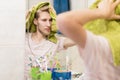 Handsome bearded man with towel, drying hair in a bathroom near mirror Royalty Free Stock Photo