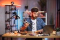 Man using laptop for searching way of fixing quadcopter Royalty Free Stock Photo