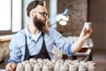 Man working with ceramics at the pottery Royalty Free Stock Photo