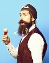 Funny handsome bearded pilot on blue studio background Royalty Free Stock Photo