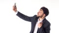 Handsome bearded young business man taking selfie smiling. portrait isolated over white studio background. Royalty Free Stock Photo