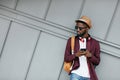 Handsome Black Man In Fashion Clothes With Phone On Street Royalty Free Stock Photo