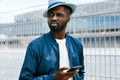 Handsome Black Man In Fashion Clothes With Phone On Street Royalty Free Stock Photo