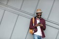 Handsome Black Man In Fashion Clothes With Phone On Street Royalty Free Stock Photo