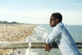 Handsome black man with sunglasses relaxing at the beach Royalty Free Stock Photo