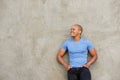 Handsome black man in t-shirt smiling and looking away Royalty Free Stock Photo