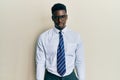 Handsome black man wearing glasses business shirt and tie depressed and worry for distress, crying angry and afraid Royalty Free Stock Photo