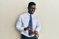 Handsome black man wearing glasses business shirt and tie disgusted expression, displeased and fearful doing disgust face because Royalty Free Stock Photo