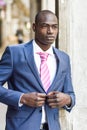 Handsome black man wearing suit in urban background Royalty Free Stock Photo