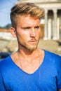 Handsome young man against stone wall Royalty Free Stock Photo