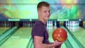 Man rolls the bowling ball