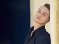 Handsome blond young man against wall Royalty Free Stock Photo