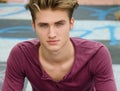 Handsome blond young man, blue eyes, looking at camera Royalty Free Stock Photo