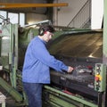 Handsome blue collar worker in factory Royalty Free Stock Photo