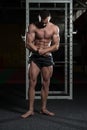 Handsome Body Builder Making Most Muscular Pose Royalty Free Stock Photo