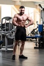 Handsome Body Builder Making Most Muscular Pose Royalty Free Stock Photo