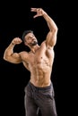 Handsome bodybuilder doing biceps pose