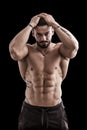 Handsome bodybuilder doing biceps pose Royalty Free Stock Photo