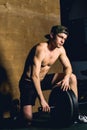 Handsome bodybuilder guy prepare to do exercises with barbell in a gym Royalty Free Stock Photo