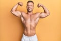 Handsome bodybuldier man posing sexy showing muscle, shirtless torso showing pectorals and sixpack Royalty Free Stock Photo