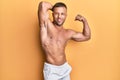 Handsome bodybuldier man posing sexy showing muscle, shirtless torso showing pectorals and sixpack Royalty Free Stock Photo