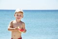 Handsome boy eating slice of watermelon on the Royalty Free Stock Photo