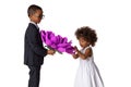 Handsome boy gives a cute girl big origami flower.Kids love.Isolated Royalty Free Stock Photo