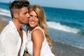 Handsome boy kissing his girlfriend on cheek. Royalty Free Stock Photo