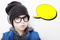 Handsome boy is wearing black cap and eyeglasses with an empty thought bubble. Royalty Free Stock Photo