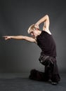 Handsome breakdancer in black clothes posing Royalty Free Stock Photo