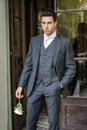 Handsome bridegroom in grey suit