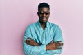 Handsome business black man wearing stylish sunglasses happy face smiling with crossed arms looking at the camera Royalty Free Stock Photo