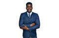 Handsome business black man wearing business suit and tie happy face smiling with crossed arms looking at the camera Royalty Free Stock Photo