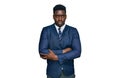 Handsome business black man wearing business suit and tie skeptic and nervous, disapproving expression on face with crossed arms Royalty Free Stock Photo