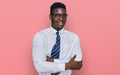 Handsome business black man wearing white shirt and tie happy face smiling with crossed arms looking at the camera Royalty Free Stock Photo