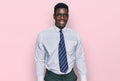 Handsome business black man wearing white shirt and tie looking positive and happy standing and smiling with a confident smile Royalty Free Stock Photo