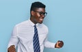 Handsome business black man wearing white shirt and tie very happy and excited doing winner gesture with arms raised, smiling and Royalty Free Stock Photo