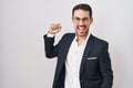 Handsome business hispanic man standing over white background dancing happy and cheerful, smiling moving casual and confident Royalty Free Stock Photo