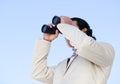 Handsome business man looking through binoculars Royalty Free Stock Photo