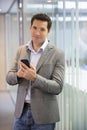 Handsome Business man at the office on phone, sms, e-mail Royalty Free Stock Photo