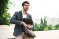Handsome business man outdoors with bag Royalty Free Stock Photo