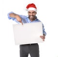 Handsome business man in santa christmas hat pointing blank billboard Royalty Free Stock Photo