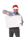 Handsome business man in santa christmas hat pointing blank billboard Royalty Free Stock Photo