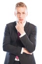 Handsome business man thinking while touching his chin Royalty Free Stock Photo